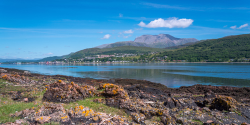 Fort William and and towering Ben Nevis seen from the opposite shore of Loch Linnhe