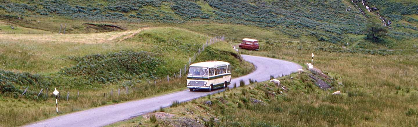 Scottish Omnibuses coach touring through the Scottish Highlands in the 1960s