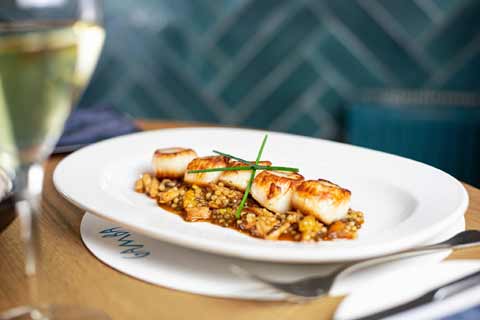 Seared King Scallops served with smoked chicken and puy lentils from Gamba Restaurant