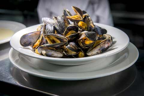 A steaming plate of mussels served at Ee-Urk Restaurant in Oban