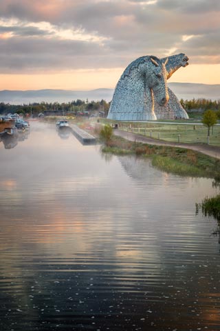 The Kelpies tower above the Forth and Clyde Canal