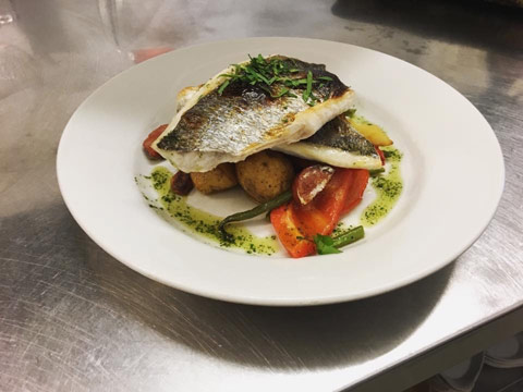 Grilled cod served with baby potatoes, carrots and peppers from the Claymore Restaurant