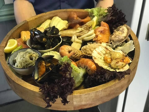 Wholesome Seafood Platter served in a wooden bowl