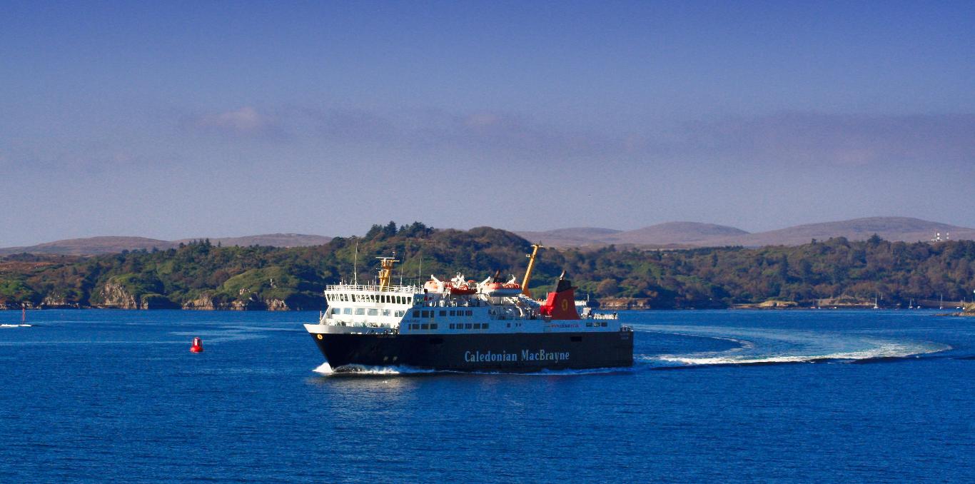 Caledonian MacBrayne ferry Isle of Mull sailing across the bright blue water of Craignure Bay heading to Oban
