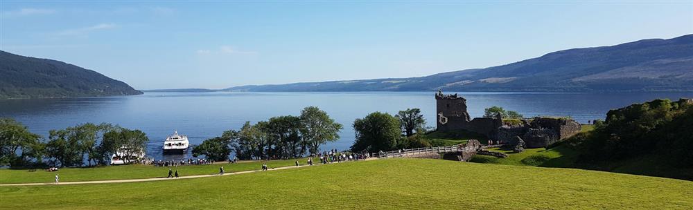 People walking along path to Urquhart Castle at Loch Ness